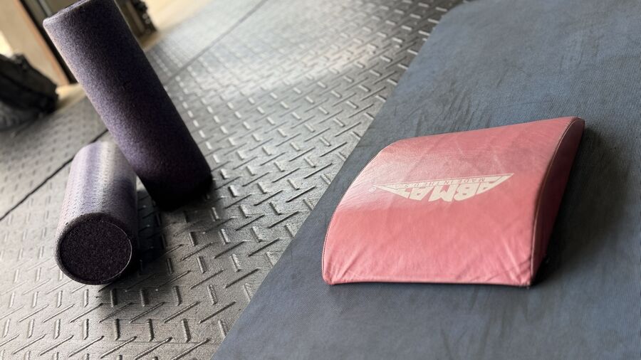 Foam rollers and an AbMat on the mat